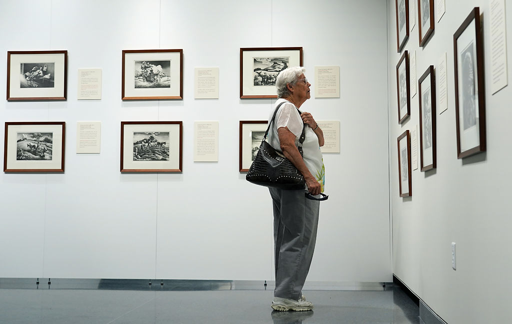 Carmen Moore looks at artwork at the new Thomas Hart Benton exhibit